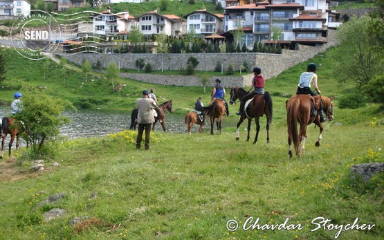 Horseback riding along Dospat Lake
